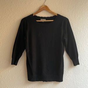 Adorable black basic sweater with scalloped neck detailing. Size M